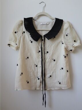 Cream Blouse with Black Peter Pan Collar and Floral Embroidery